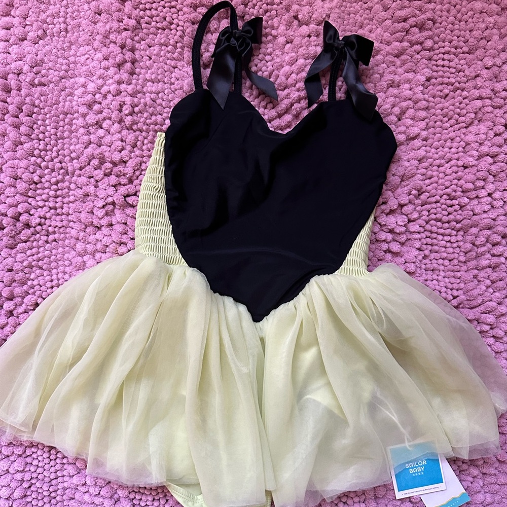 New with Tag girl's swimming suit 8 years old